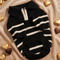 Load image into Gallery viewer, Black and white striped dog sweater on a beige fabric background with heart-shaped chocolates.