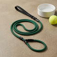 Load image into Gallery viewer, Green dog leash with black clips on a beige surface, next to a white bowl and yellow tennis ball.