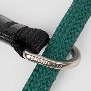 dog collar with reflective logo, leather connector sleeve, mountainering grade activity buckle, and double silicone stop buckle.